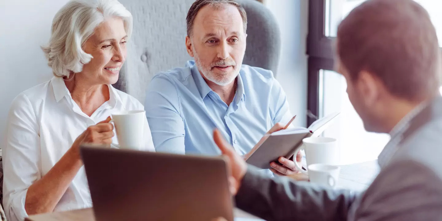 old couple getting advice from advisor